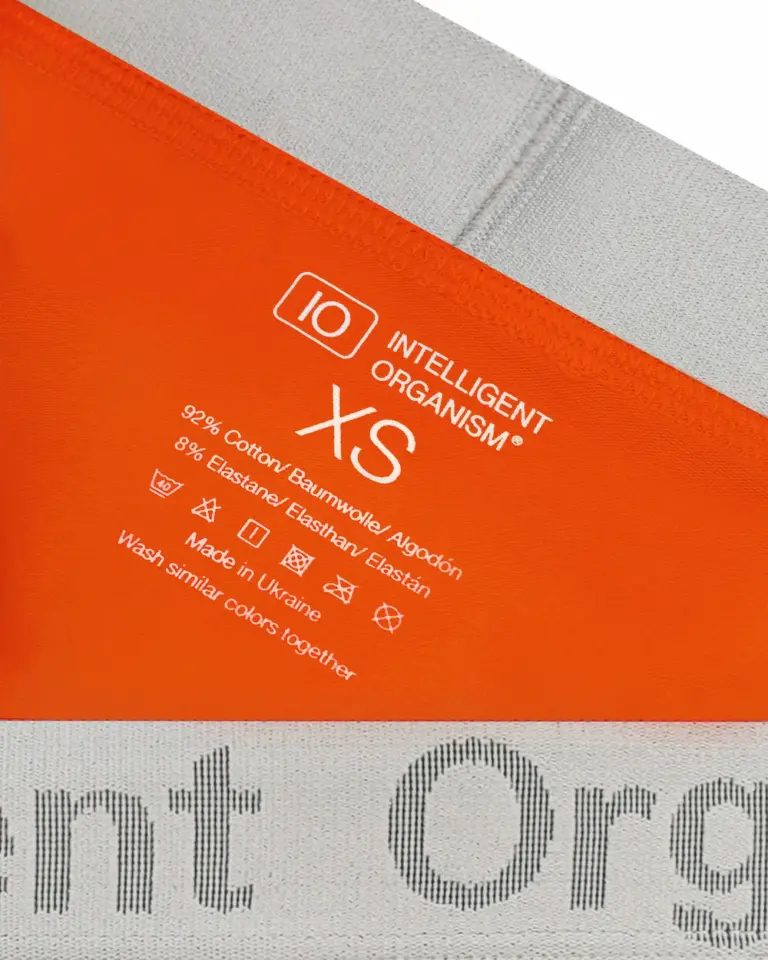 Жіночі помаранчеві стрінги Intelligent Organism — внутрішній вигляд з термотрансферним розміром