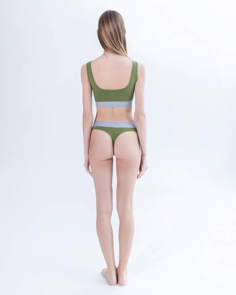 Жіночі зелені стрінги з бавовни Intelligent Organism на моделі, вигляд ззаду